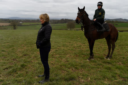 Racehorse trainer Jessica Harrington (L), stands with her daughter, jockey Kate Harrington, during training at her stables in Moone, Ireland, April 6, 2017. REUTERS/Clodagh Kilcoyne