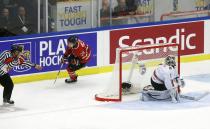 Canada's Anthony Mantha (L) scores on Switzerland's goalie Melvin Nyffeler with a penalty shot during the second period of their IIHF World Junior Championship ice hockey game in Malmo, Sweden, January 2, 2014. REUTERS/Alexander Demianchuk (SWEDEN - Tags: SPORT ICE HOCKEY)