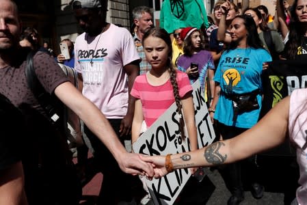 Sixteen year-old Swedish climate activist Greta Thunberg takes part in a demonstration as part of the Global Climate Strike in Manhattan in New York