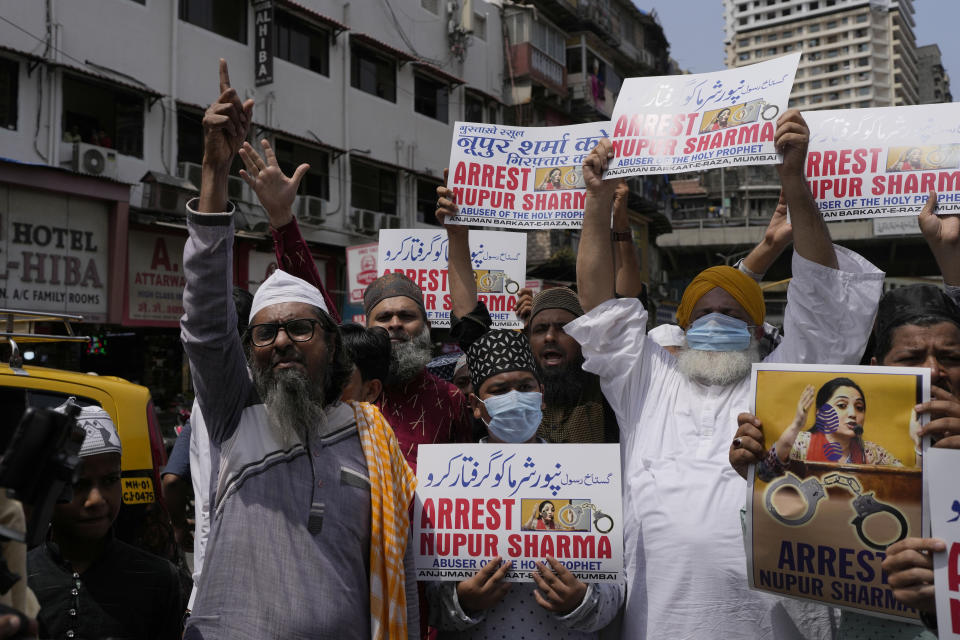 Indian Muslims hold placards demanding the arrest of Nupur Sharma, a spokesperson of governing Hindu nationalist party as they react to the derogatory references to Islam and the Prophet Muhammad made by her during a protest in Mumbai, India, Monday, June 6, 2022. At least five Arab nations have lodged official protests against India, and Pakistan and Afghanistan also reacted strongly Monday to the comments made by two prominent spokespeople from Prime Minister Narendra Modi's Bharatiya Janata Party. (AP Photo/Rafiq Maqbool)