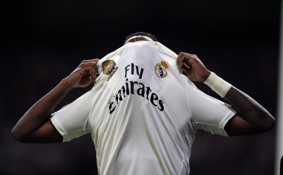 The injured Real forward Vinicius Junior reacts during the Champions League round of 16 second leg soccer match soccer match between Real Madrid and Ajax at the Santiago Bernabeu stadium in Madrid, Tuesday, March 5, 2019. (AP Photo/Bernat Armangue)