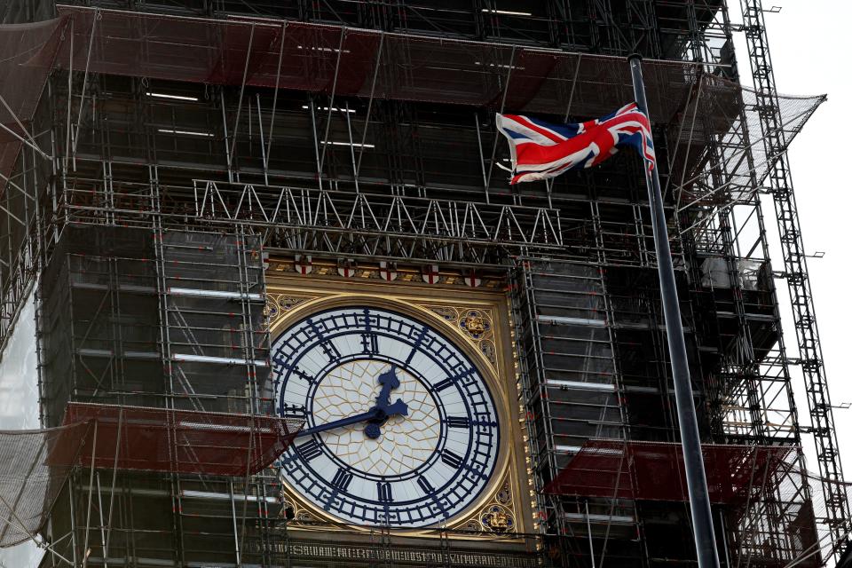 The Union flag flutters near the clockface of Big Ben during ongoing renovations to the Tower and the Houses of Parliament, in central London on January 7, 2020. (Photo by Adrian DENNIS / AFP) (Photo by ADRIAN DENNIS/AFP via Getty Images)