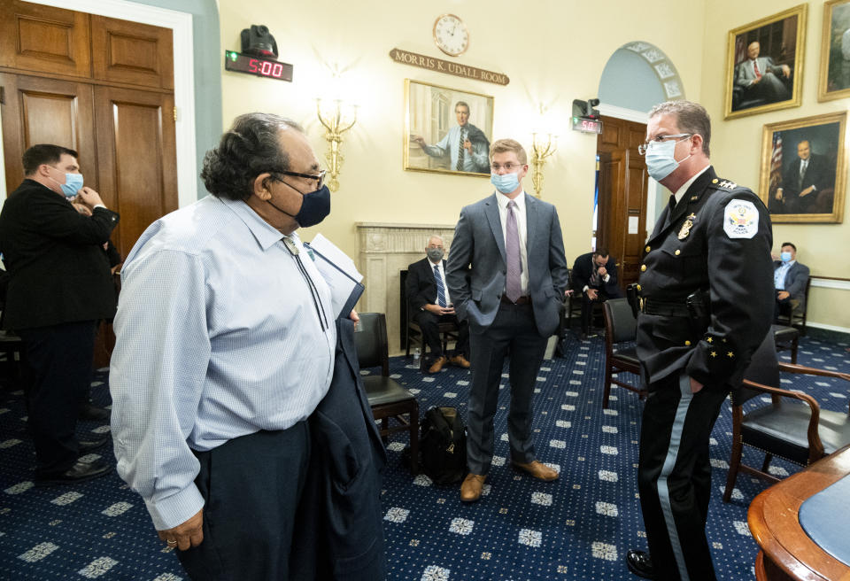 Chairman Raúl Grijalva, D-Ariz., left, speaks with Acting U.S. Park Police Chief Gregory T. Monahan, prior to a House Natural Resources Committee hearing on actions taken on June 1, 2020 at Lafayette Square, Tuesday, July 28, 2020 on Capitol Hill in Washington. (Bill Clark/Pool via AP)