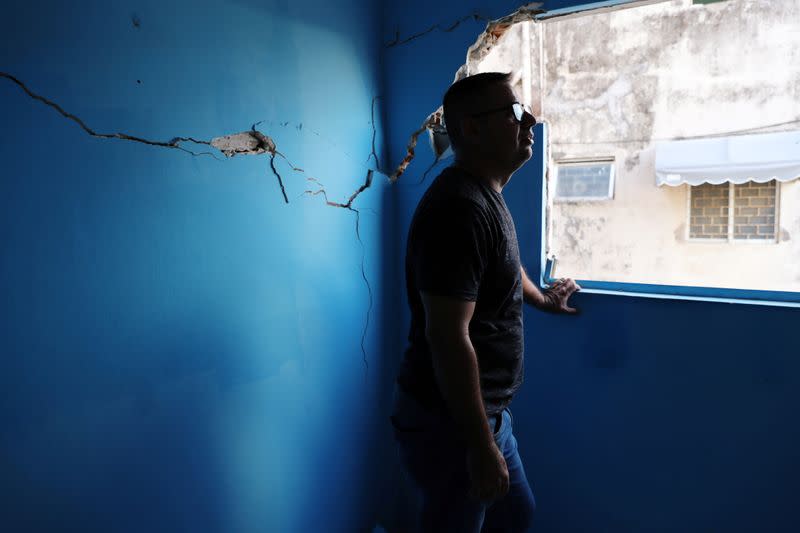 Marcio da Rocha Cavalcante is pictured in an apartment with cracks linked to rock salt mining by the petrochemical company Braskem in Maceio