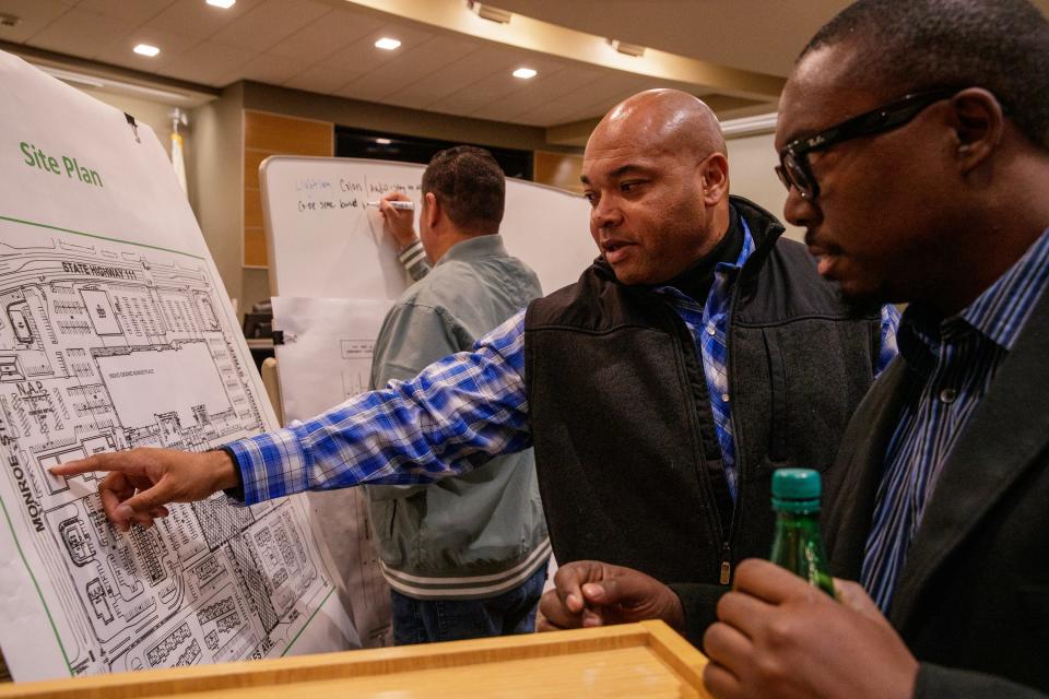 Indio Mayor Waymond Fermon, center, and Robert Salter, Jr. of Indio share ideas about the John Nobles Memorial Park in Indio, Calif., on Nov. 30, 2022. 