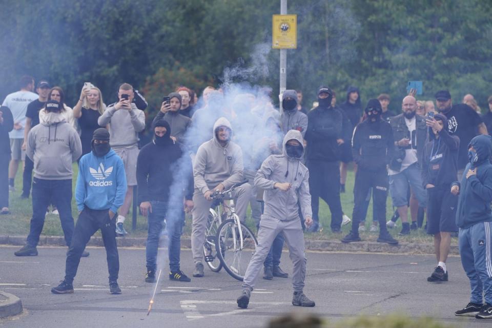 Racist thugs have vandalised shops, targeted people of colour, and set alight hotels housing asylum seekers in a shocking display of violence (PA Wire)