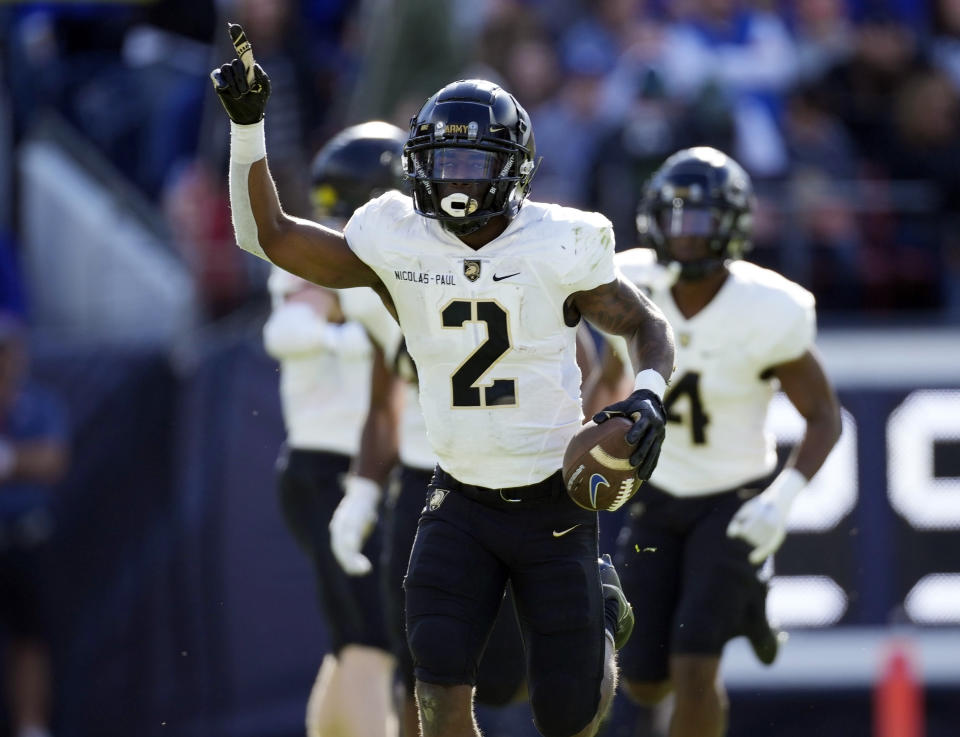 Army defensive back Bo Nicolas-Paul gestures after intercepting a pass against Air Force in the first half of an NCAA college football game Saturday, Nov. 4, 2023, in Denver. (AP Photo/David Zalubowski)