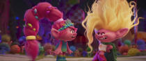 This image released by DreamWorks Animation shows the characters Queen Poppy voiced by Anna Kendrick, left, and Viva voiced by Camila Cabello, in a scene of the animated film "Trolls Band Together." (DreamWorks Animation via AP)