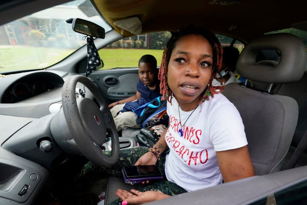 Syreeta Tatum, right, speaks about the disappointment her children expressed at having to again undertake virtual learning classes due to the city’s water issues that forced Jackson Public Schools to close for several days, Tuesday, Sept. 6, 2022, in Jackson, Miss. (AP Photo/Rogelio V. Solis)