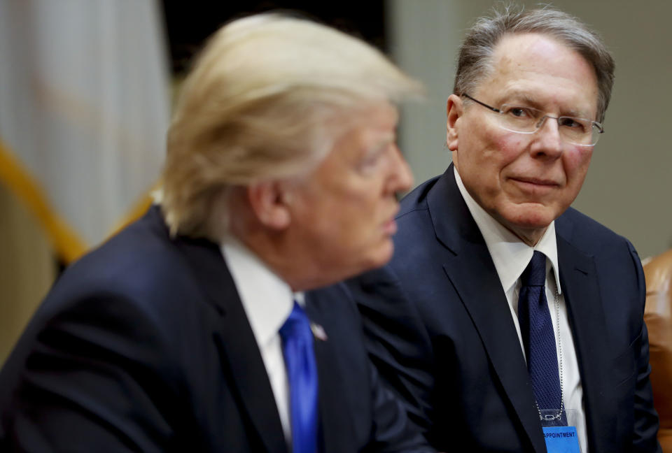 FILE - In a Feb. 1, 2017, file photo, National Rifle Associations (NRA) Executive Vice President and Chief Executive Officer Wayne LaPierre listens at right as President Donald Trump speaks in the Roosevelt Room of the White House in Washington. In the latest national furor over mass killings, the tremendous political power of the NRA is likely to stymie any major changes to gun laws. The man behind the organization is LaPierre, the public face of the Second Amendment with his bombastic defense of guns, freedom and country in the aftermath of every mass shooting. (AP Photo/Pablo Martinez Monsivais, File)