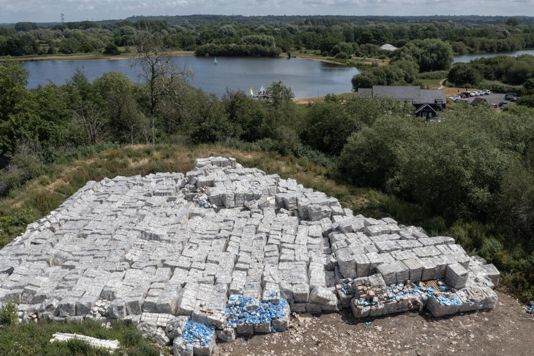 CALMORE, UNITED KINGDOM - JUNE 19: Boxes of PPE are discarded on an area of land near Testwood Lakes nature reserve on June 19, 2023 in Calmore, England. The stacks of boxes are thought to include unused aprons and face masks procured during the Covid-19 pandemic, and were subsequently discarded on land next to the Testwood Lakes Nature Reserve. The items were produced by a company called Full Support Healthcare, which had a government contract to provide PPE to the National Health Service during the pandemic. The government later sold the stockpile to a third-party company while auctioning off excess PPE, and it's unclear who was responsible for its disposal in Calmore. (Photo by Dan Kitwood/Getty Images)