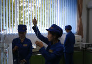 In this Oct. 22, 2018, photo, workers test samples of products for consistency at the factory lab at Songdowon General Foodstuffs Factory in Wonsan, North Korea. Though the international spotlight has been on his denuclearization talks with Washington, the North Korean leader has a lot riding domestically on his promises to boost the country's economy and standard of living. His announcement in April that North Korea had sufficiently developed its nuclear weapons and would now focus on building its economy marked a sharp turn in official policy and set the stage for his rapid-fire meetings with the leaders of China, South Korea and the United States. (AP Photo/Dita Alangkara)