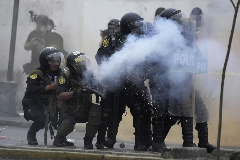 Police launch tear gas to disperse demonstrators seeking immediate elections, President Dina Boluarte's resignation, the release of ousted President Pedro Castillo and justice for protesters killed in clashes with police, in Lima, Peru, Saturday, Jan. 28, 2023. (AP Photo/Martin Mejia)