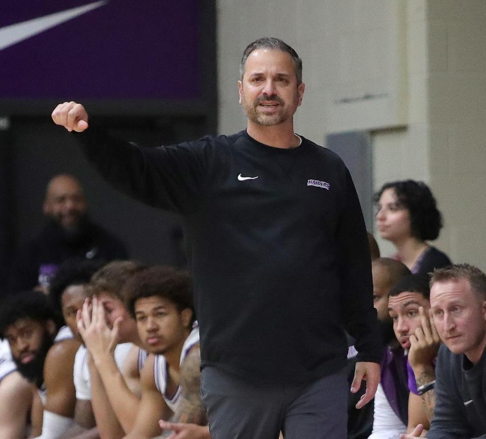 Mount Union men's basketball coach Mike Fuline signals to his team during the Purple Raiders' first home game of the 2023-24 season.