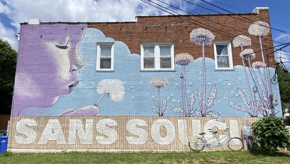 A mural along Old Buncombe Road encourages community pride in the Sans Souci neighborhood in Greenville County.