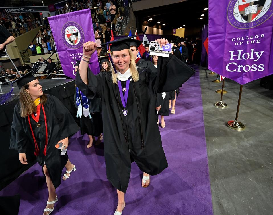 Olivia Grace Evans proceeds into the DCU Center with her class at the College of the Holy Cross graduation ceremony Friday morning.