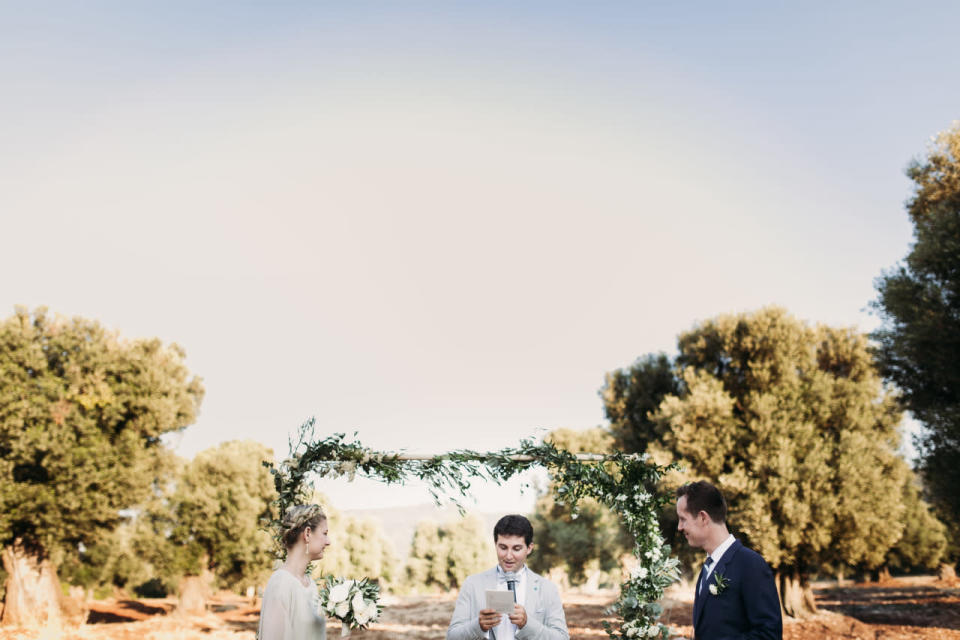 A floral arbor was erected on the ceremony site.