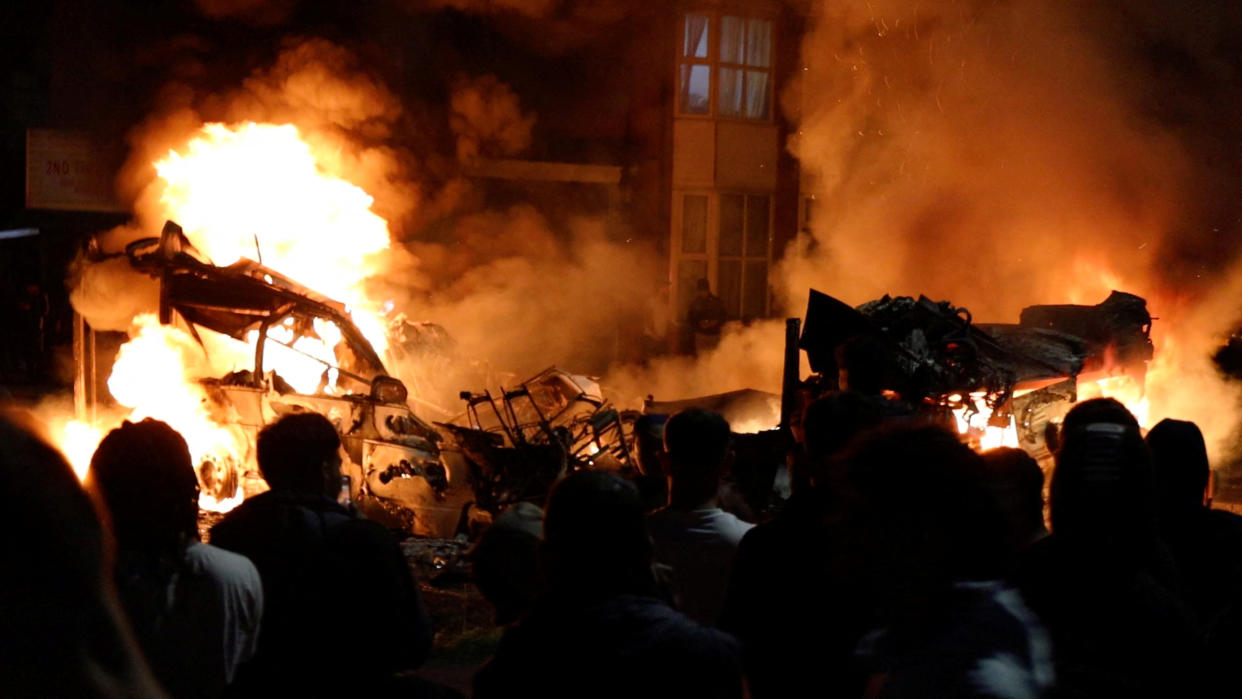 Fires burn during unrest in Harehills, Leeds, Britain, July 18, 2024 in this still image obtained from social media video.  ?@robin_singh? via Instagram/via REUTERS  THIS IMAGE HAS BEEN SUPPLIED BY A THIRD PARTY. MANDATORY CREDIT.