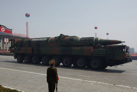 A rocket is carried by a military vehicle during a military parade in Pyongyang. REUTERS/Bobby Yip