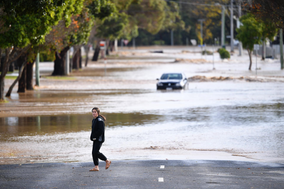 A person is seen observing the flood water in Traralgon. Source: AAP