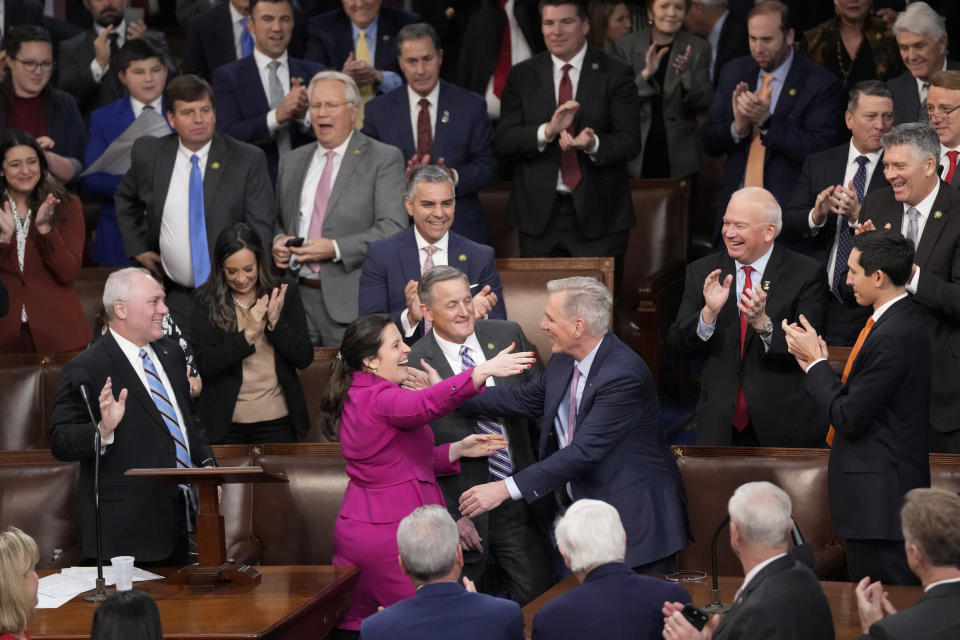 Lawmakers congratulate Kevin McCarthy after he won the 15th vote in the House Chamber. 