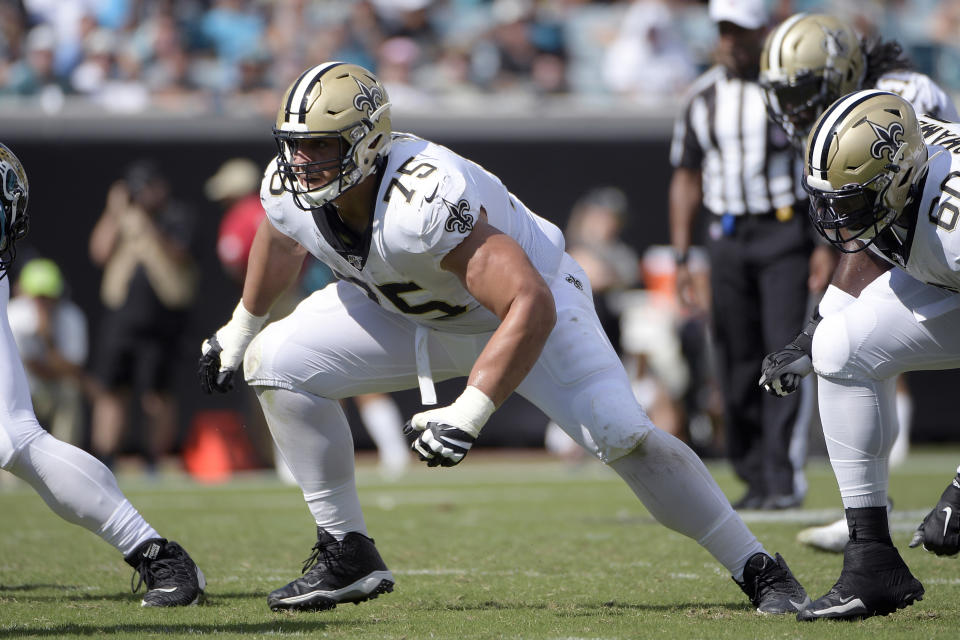 FILE - In this Oct. 13, 2019 file photo, New Orleans Saints offensive guard Andrus Peat (75) sets up to block during the second half of an NFL football game against the Jacksonville Jaguars in Jacksonville, Fla. Saints free agent left guard Andrus Peat has agreed to a five-year contract keeping him in New Orleans, general manager Mickey Loomis said. (AP Photo/Phelan M. Ebenhack, File)
