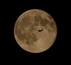 An airplane flies in front of the brilliant Blue Moon full moon of July 31, 2015 in this stunning photo captured by skywatcher Chris Jankowski of Eerie, Pennsylvania on July 31, 2015.