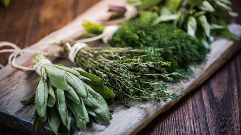 various herbs on wooden board