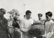 The ashes of India's late Prime Minister Jawaharlal Nehru are carried in an urn by his grandsons Rajiv and Sanjaya Ghandhi in a funeral procession from New Delhi to Allahabad, Nehru's birthplace.