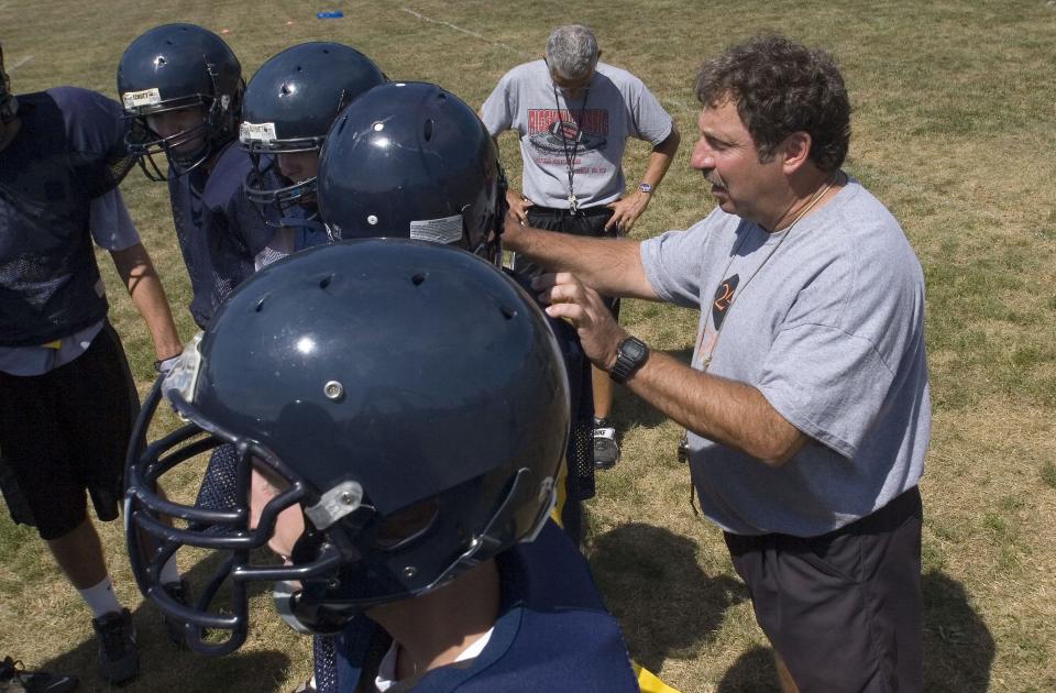 Mike D'Aloisio calls offensive plays during a preseason practice in 2010.