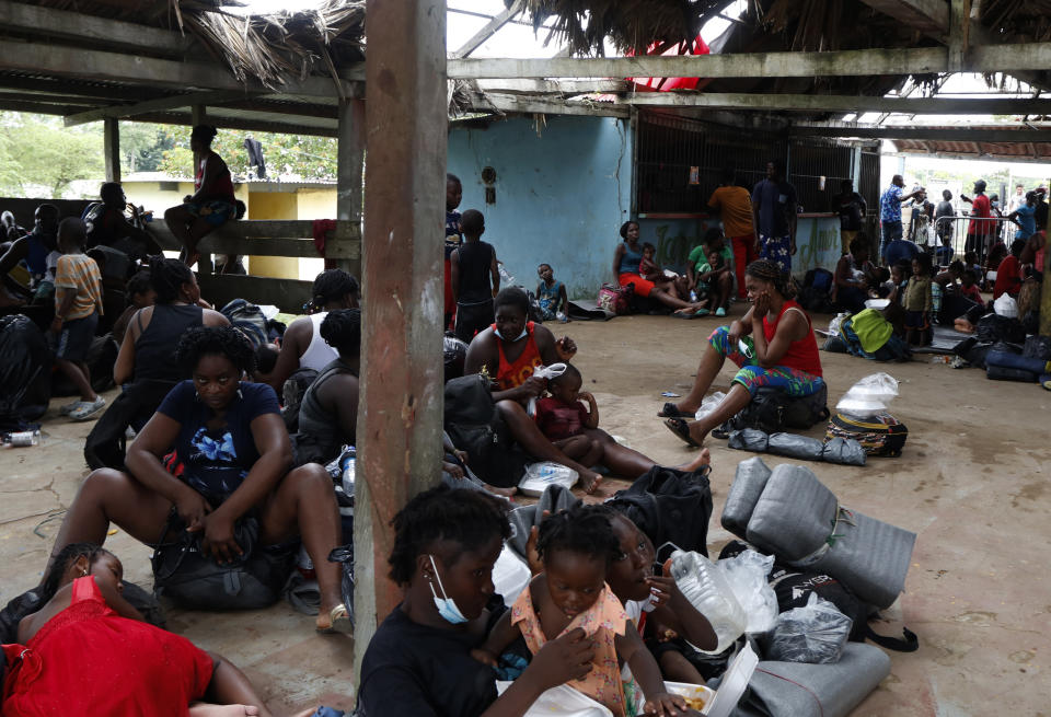 Migrants rest at a shelter in Lajas Blancas, Darien, Panama, Saturday, Oct. 23, 2021. A rising number of female migrants have reported suffering sexual abuse while crossing the treacherous Darien Gap between Colombia and Panama. Seeking to draw attention to the issue, a group of Panamanian lawmakers travelled Saturday on a fact-finding mission to speak with victims and authorities in the remote province. (AP Photo/Ana Renteria)