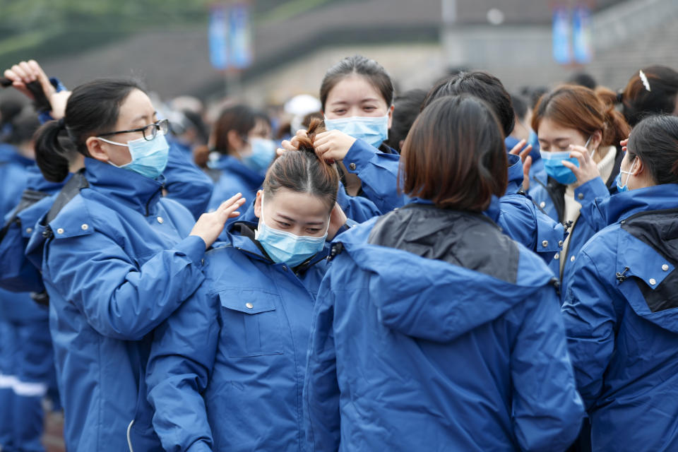 (200211) -- CHONGQING, Feb. 11, 2020 (Xinhua) -- Medical team members from Chongqing are seen at the gathering spot in southwest China's Chongqing, Feb. 11, 2020. A team comprised of 159 medical workers from Chongqing left for Xiaogan City of Hubei Province on Tuesday to aid the novel coronavirus control efforts there. They will work together with the first batch of medical workers who were dispatched there on Jan. 26. (Photo by Huang Wei/Xinhua) (Xinhua/Huang Wei via Getty Images)
