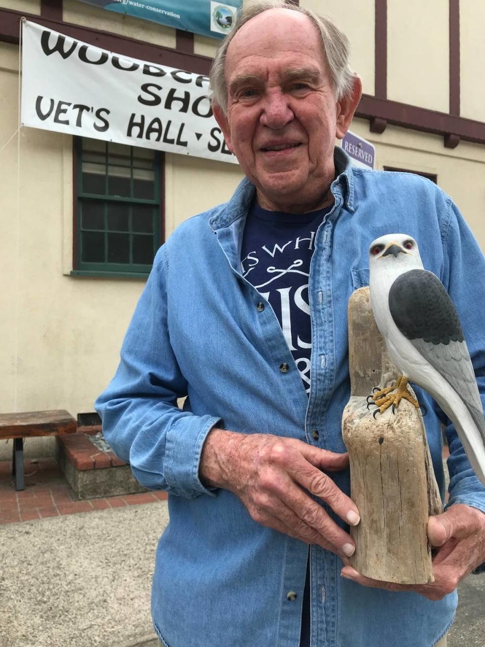 Dick Marshall, a Cambria wood carver, shows off the white-tailed kite sculpture he created. His work will be on display at the Central Coast Wood Carvers show on Saturday and Sunday, Sept. 16 and 17, 2023, at the Cambria Veterans Memorial Building.
