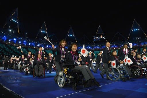 Members of Japan's delegation parade during the opening ceremony of the London 2012 Paralympic Games at the Olympic Stadium in east London. The Paralympic cauldron was lit in London on Wednesday to burn for 11 days of sport at the biggest and most high-profile Games that organisers hope will transform ideas about disability the world over