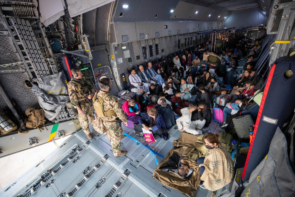 Evacuees from Kabul arrive at Tashkent Airport in Uzbekistan. (Marc Tessensohn/Bundeswehr via Getty Images)