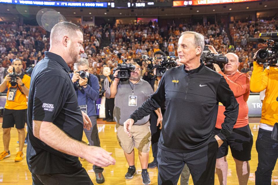 Texas head coach Chris Beard, left, greets Tennessee head coach and former Texas head coach Rick Barnes, right, before their game at the Erwin Center on Jan. 29, 2022.