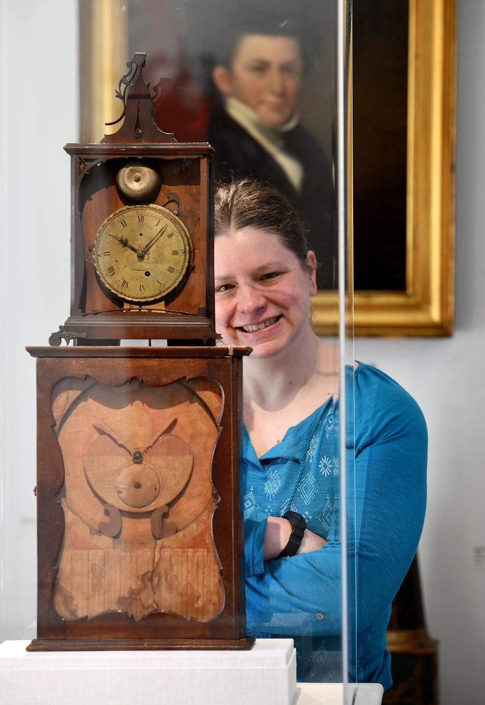 Willard House & Clock Museum Administrative Assistant Sarah Mullen with Simon Willard's Astronomical Shelf Timekeeper, circa 1781-1784.