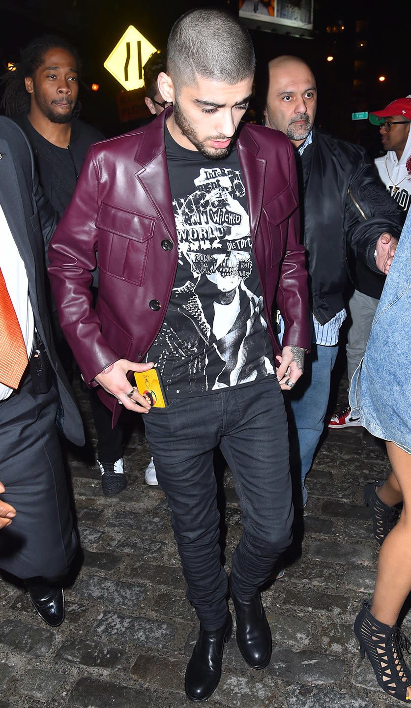 Wearing a Bally jacket, Dsquared2 shirt, and Diesel jeans.