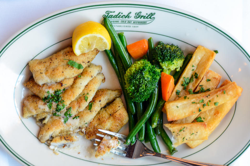 Pan-fried sand dabs with long branch potatoes, vegetables and butter sauce at Tadich Grill. (Photo: The Washington Post via Getty Images)