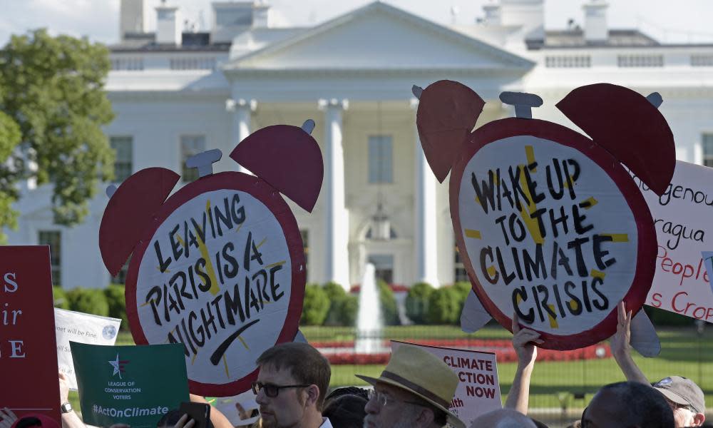 Protesters gather outside the White House in Washington to protest President Donald Trump’s decision to withdraw the Unites States from the Paris climate change accord