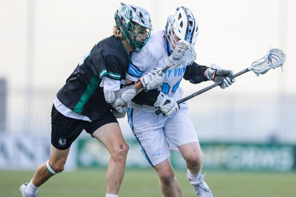 Sky View’s Stockton Checketts (83) battles Green Canyon’s Tommy Russon (65) for the ball during the 4A boys lacrosse championships at Zions Bank Stadium in Herriman on May 26, 2023. | Ryan Sun, Deseret News