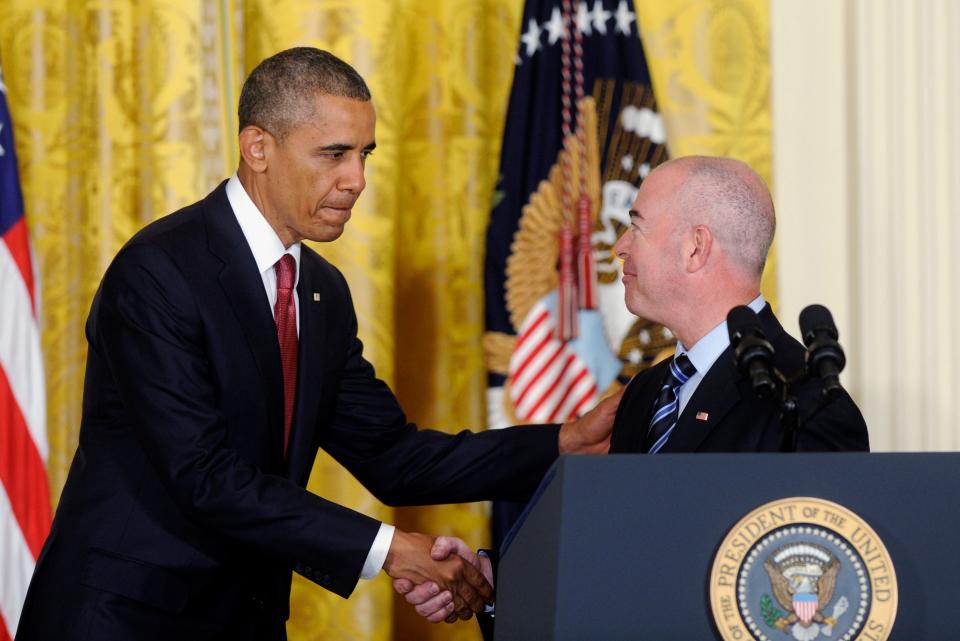 President Barack Obama shakes hands with Deputy Homeland Security Secretary Alejandro Mayorkas after a naturalization ceremony for active-duty service members and civilians on  July 4, 2014, in the East Room of the White House in Washington.