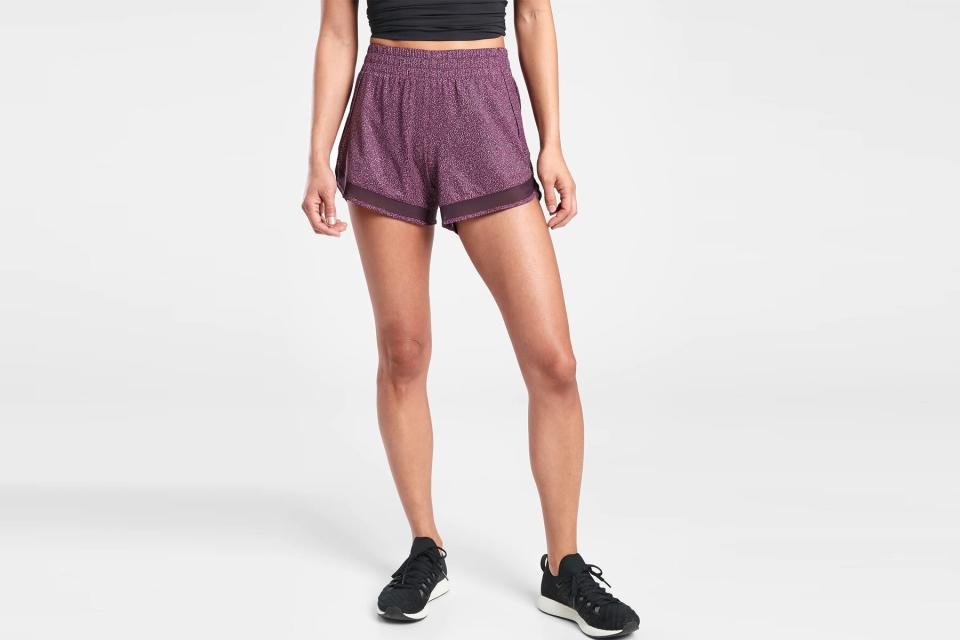 Woman wearing purple running shorts