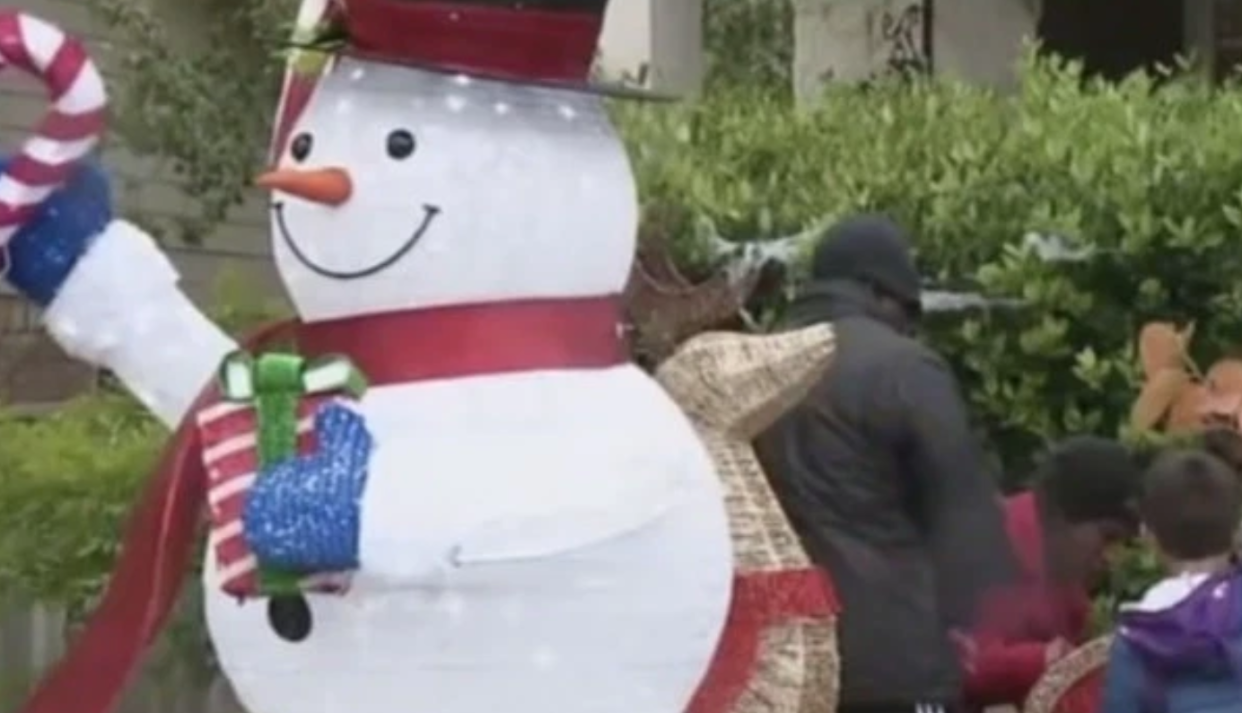 A Texas family does not plan to remove their Christmas decorations, despite orders from their HOA. (Photo: WOAI)