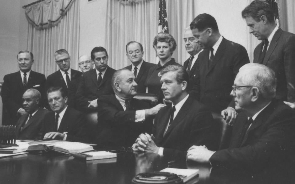 President Lyndon B. Johnson (seated, center) with members of the Kerner Commission on July 29, 1967.