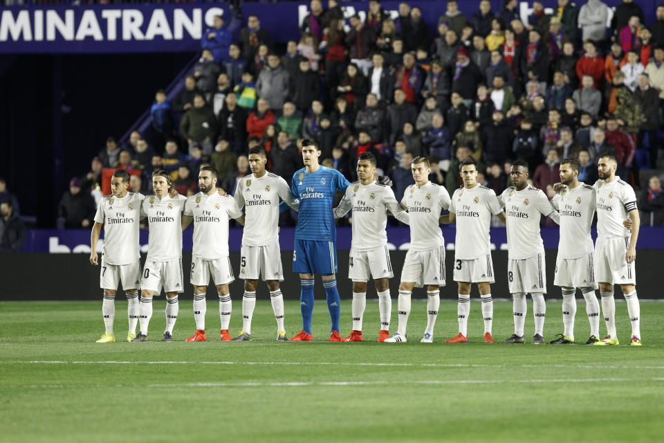 Real Madrid players stand prior the Spanish La Liga soccer match against Levante at the Ciutat de Valencia stadium in Valencia, Spain, Sunday, Feb. 24, 2019.(AP Photo/Alberto Saiz)