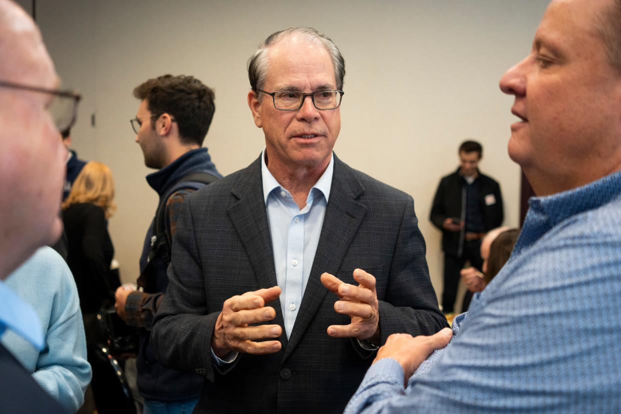 Sen. Mike Braun, middle, talks with attendees of the National Federation of Independent Businesses gubernatorial candidate forum and luncheon on Tuesday, March 19, 2024, at the Wellington Fishers Banquet & Conference Center in Fishers, Indiana.