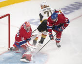 Montreal Canadiens goaltender Carey Price stops Vegas Golden Knights' William Karlsson (71) as Canadiens' Nick Suzuki defends during the third period of Game 3 of an NHL hockey semifinal series, Friday, June 18, 2021, in Montreal. (Paul Chiasson/The Canadian Press via AP)