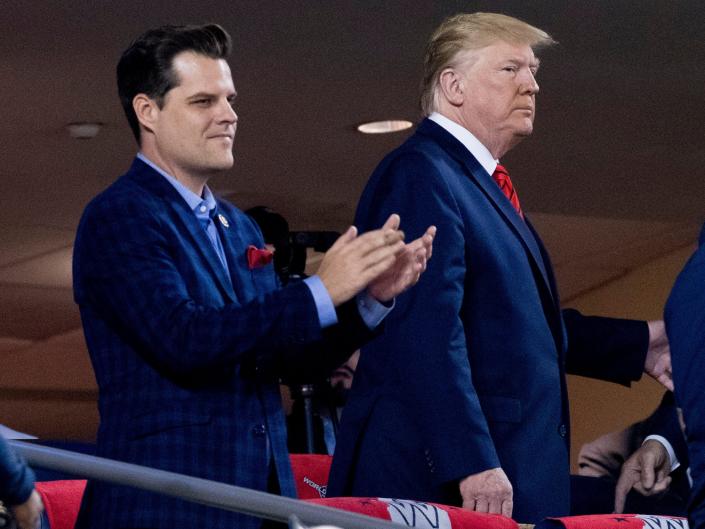In this Oct. 27, 2019, file photo President Donald Trump, right, accompanied by Rep. Matt Gaetz, R-Fla., left, arrive for Game 5 of the World Series baseball game between the Houston Astros and the Washington Nationals at Nationals Park in Washington.