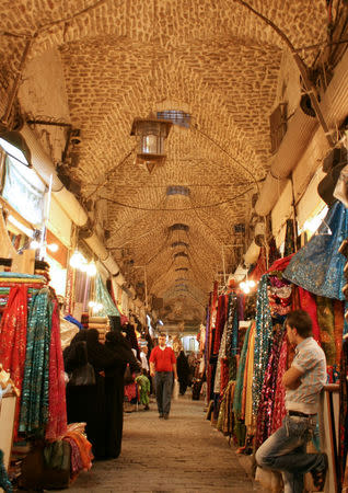 People shop at a market in the Old City of Aleppo, Syria October 6, 2010. REUTERS/Khalil Ashawi